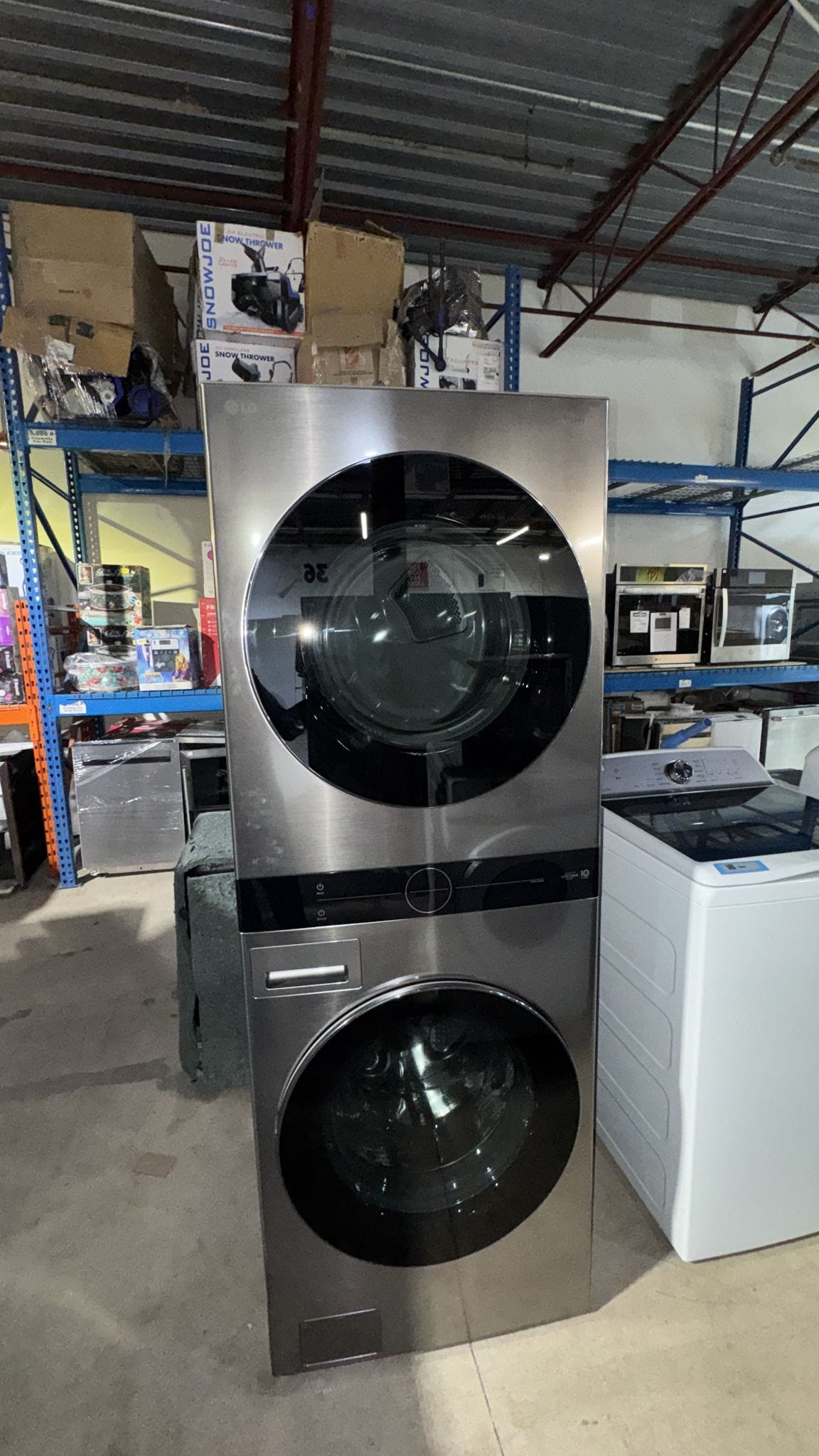 LG Graphite Steel Single Unit Front Load Wash Tower™ with 5.2 cu. ft. Steam Washer and 7.4 cu. ft. Electric Steam Dryer WKEX200vGA